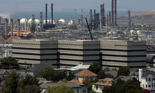 Richmond, California – home to a Chevron oil refinery – has filed a lawsuit against 29 fossil fuel companies to seek damages. Photograph: Getty Images